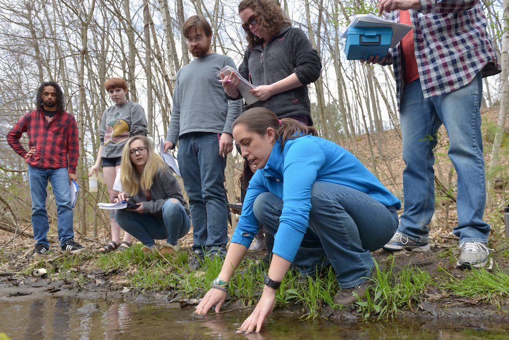 A biology class tests pond water on the HCC campus
